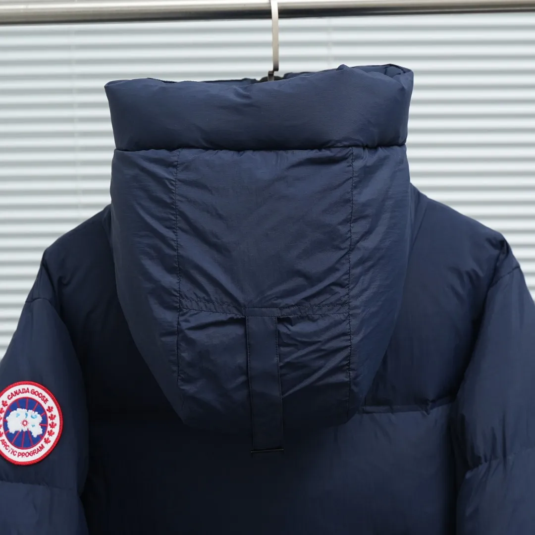 P940 Canada Goose Lawrence Down Jacket The Lawrence Down Jacket provides essential protection for everyday adventures and is made from sustainable Enduraluxe fabric with a durable soft touch. It features a quilted body, an adjustable down hood and a longer hem. Adjustable, down-filled, communicated hood. Two-way center front zipper increases range of motion and ventilation. The chin-protecting suede knit stand-up collar is soft and extra-comfortable. Inset rib-knit cuffs for added comfort and locked in heat. CORDURAD piping at the cuffs hem and reflective double-stripe grip tape at the back. Internal shoulder strap Color: black with red label black with black label azure blue Size: XS-2XL